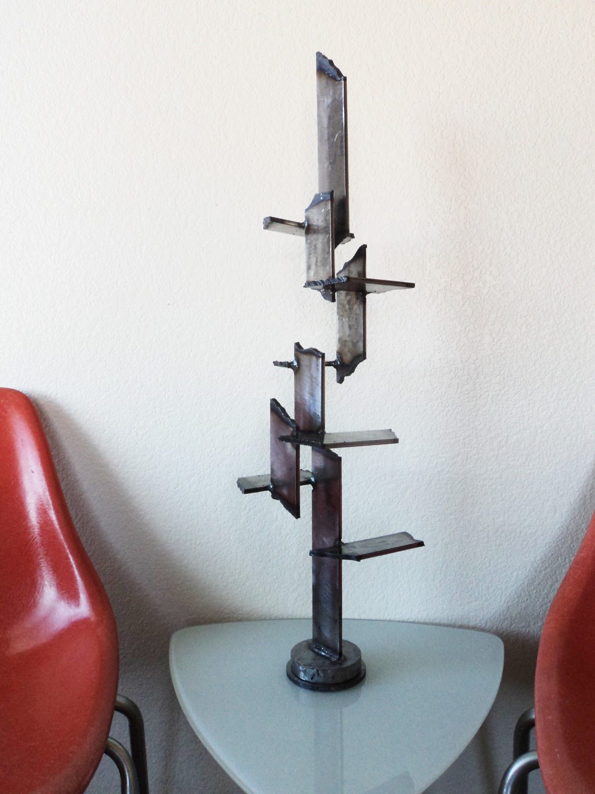 Reborn Reborn - brutalist welded steel sculpture by Corey Ellis