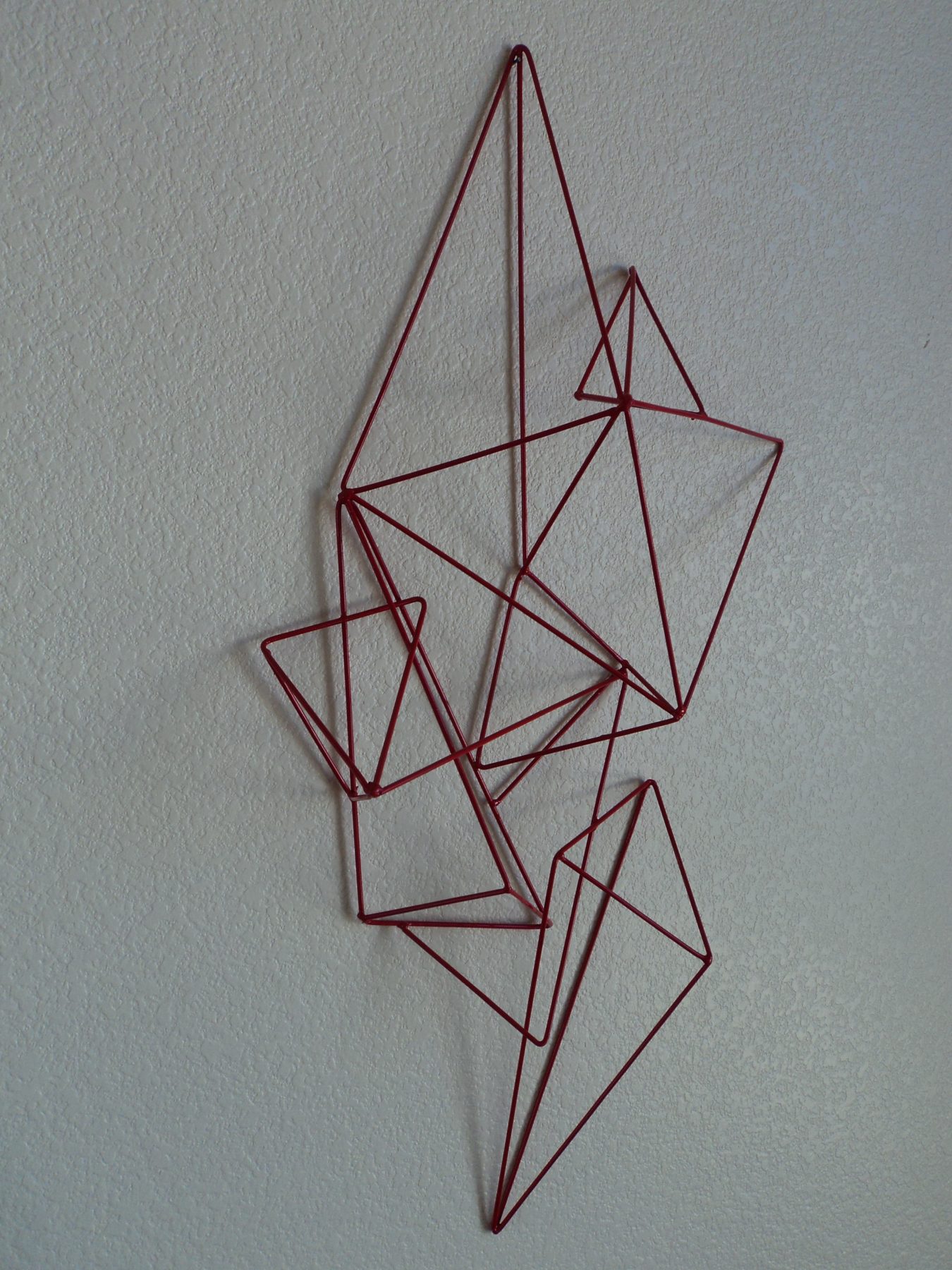 Cross-hatched welded steel geometric wall sculpture