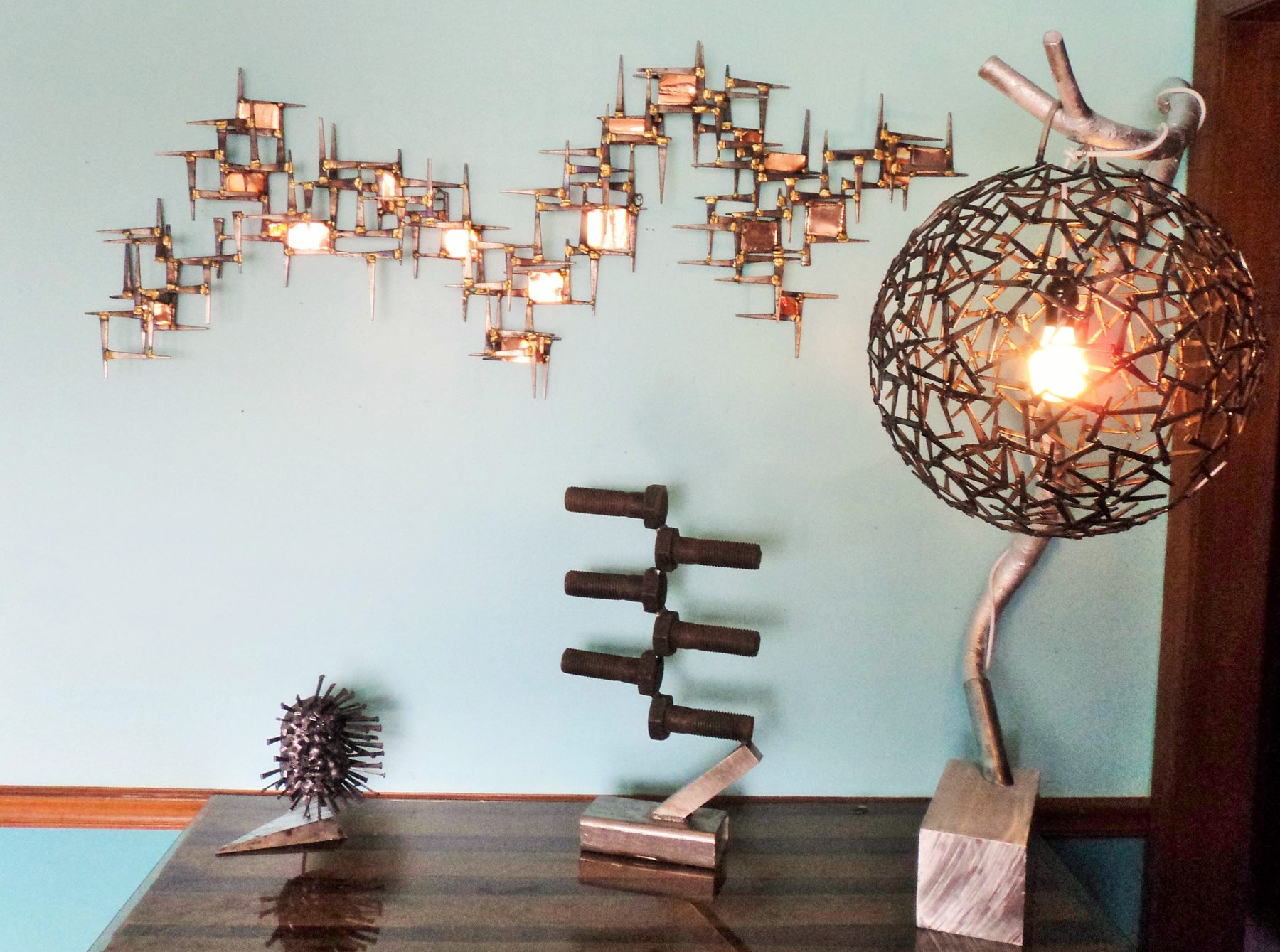 Welded metal lamp with custom sculptural base