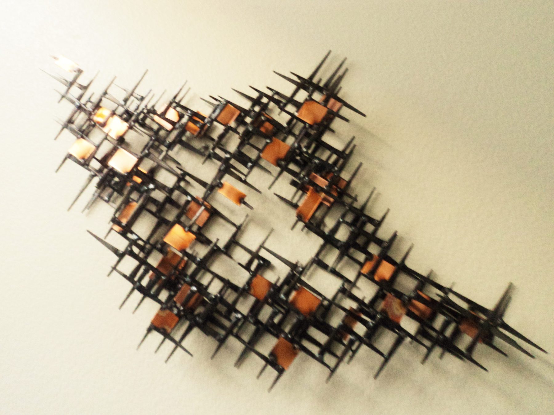 Welded steel mid-century starburst wall sculpture