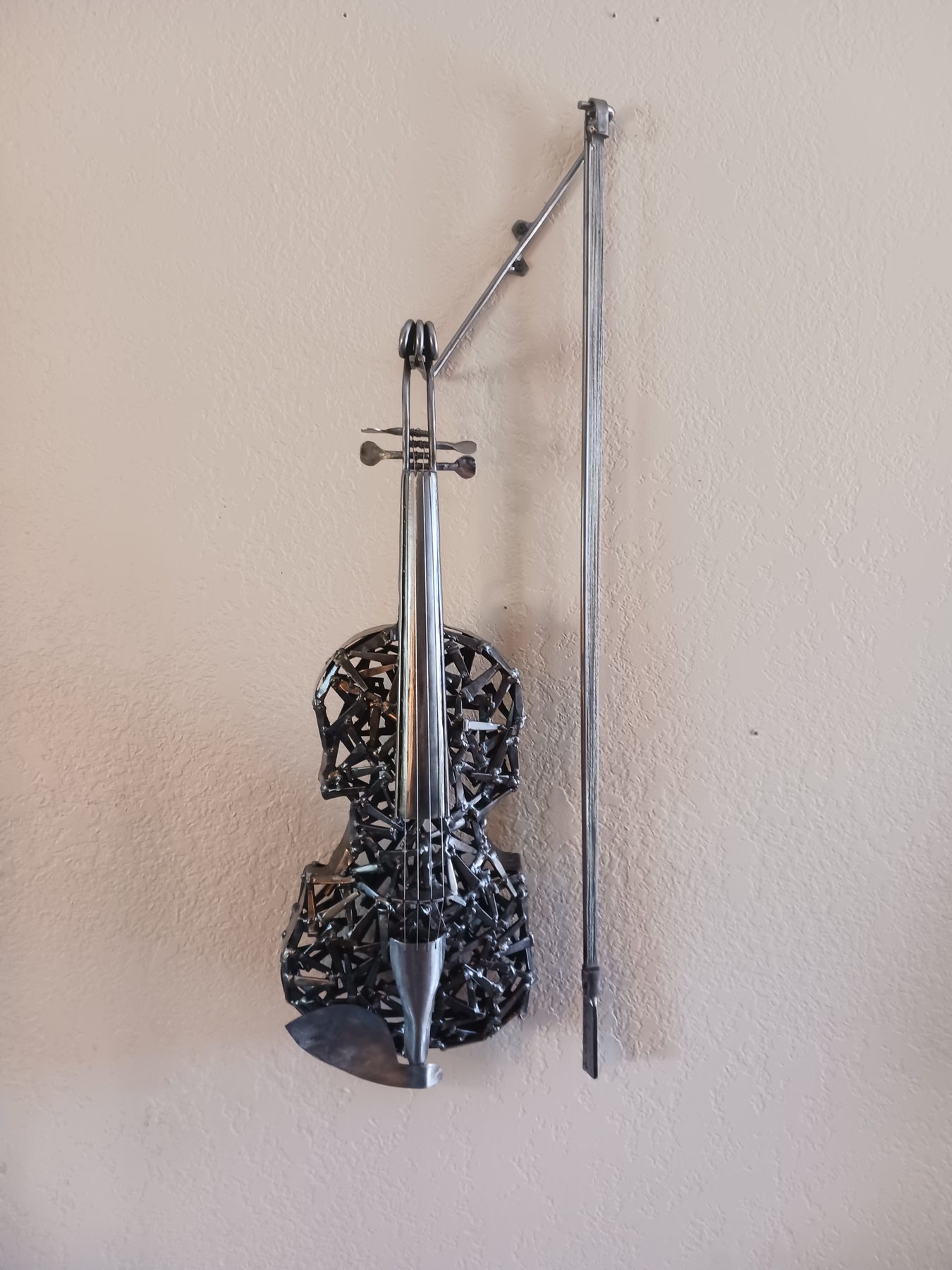 Custom welded metal musical instrument sculpture by Corey Ellis