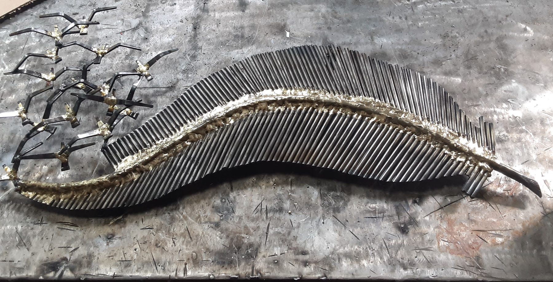 Feather - welded metal sculpture by Corey Ellis