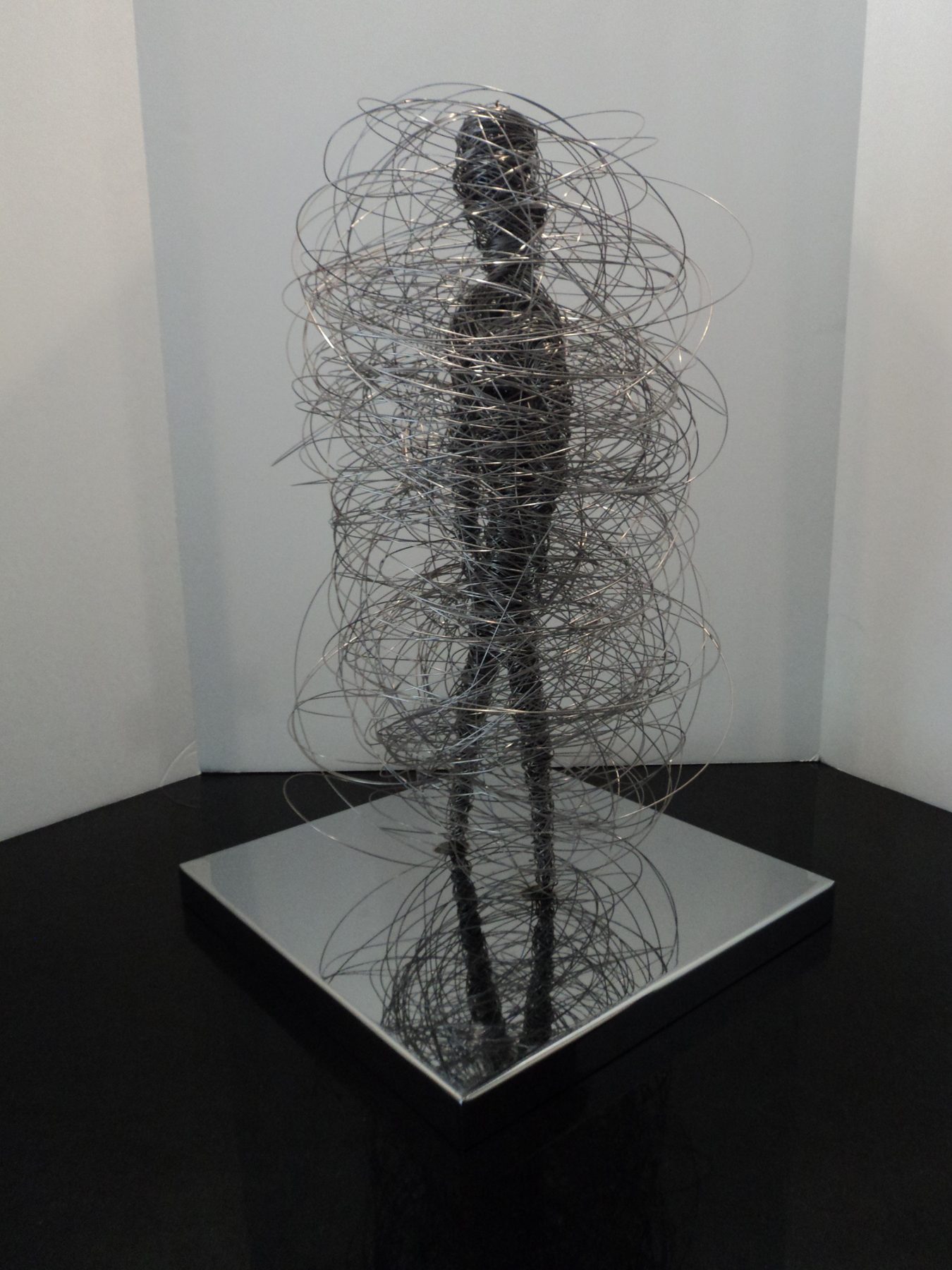 Polished stainless steel modern wall sculpture