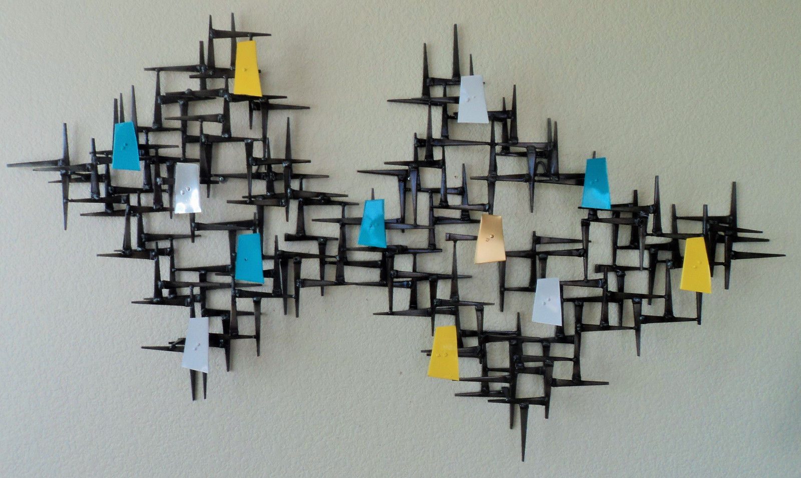 Modern welded metal wall sculpture with cool patina Modern welded metal wall sculpture with cool patina