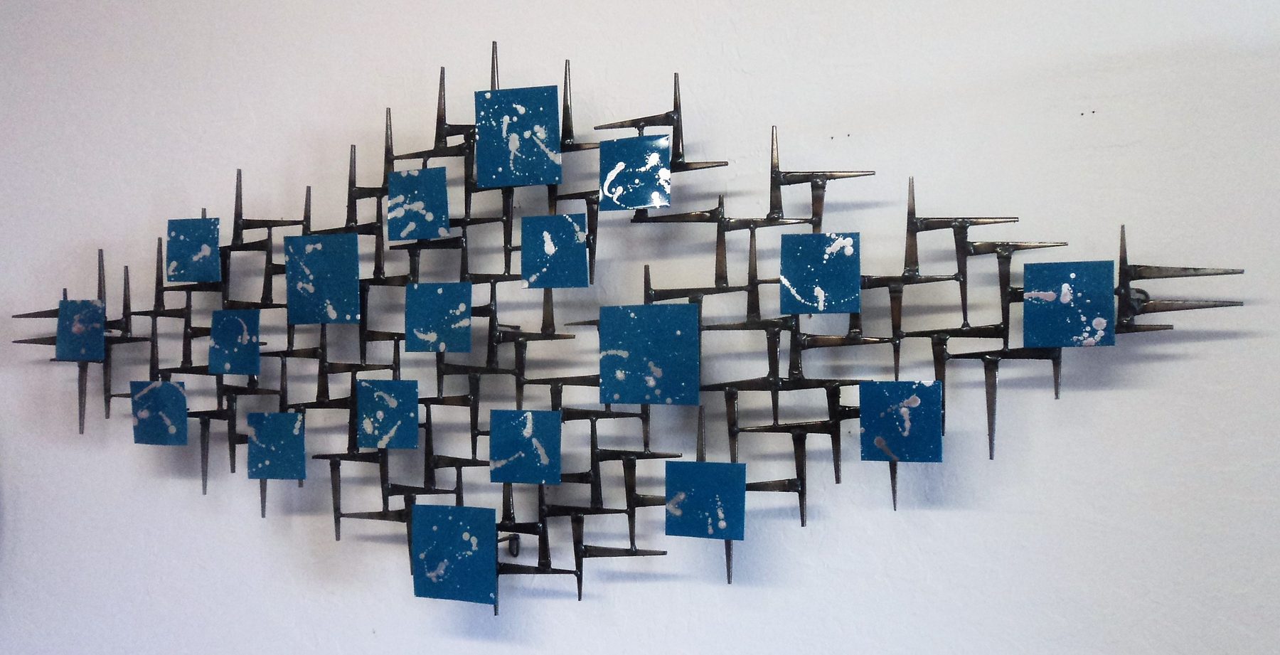 Silver Rain - flowing stainless steel modern wall sculpture by Corey Ellis
